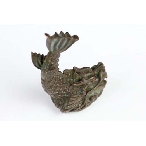 259 - Cast bronze figurine in the form of a Chinese dragon fish. Measures 7cm tall.