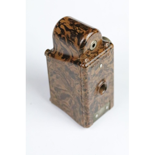 263 - 1930s Coronet midget miniature film camera / spy camera with leather case. Measures 6cm.