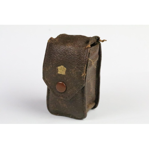 263 - 1930s Coronet midget miniature film camera / spy camera with leather case. Measures 6cm.