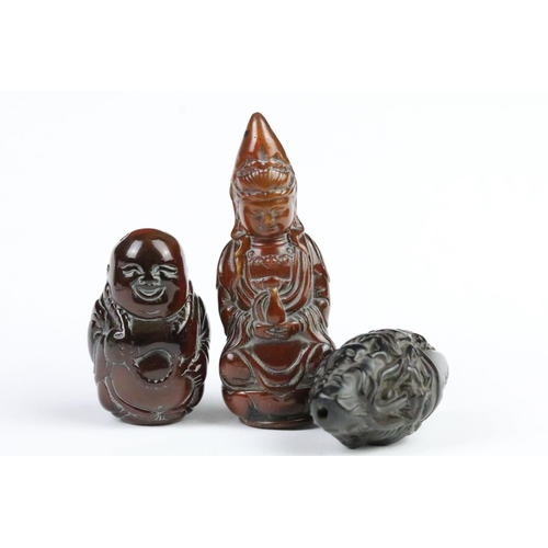 277 - Three carved netsuke toggles to include a laughing Buddha, Guanyin and mask toggle. Largest measures... 