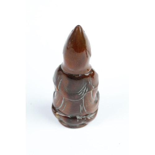 277 - Three carved netsuke toggles to include a laughing Buddha, Guanyin and mask toggle. Largest measures... 