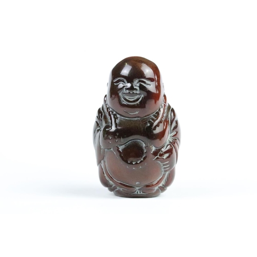 277 - Three carved netsuke toggles to include a laughing Buddha, Guanyin and mask toggle. Largest measures... 