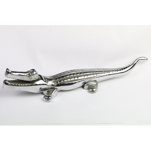 281 - Pair of Victorian candle snuffers with wick trimming action together with a cast metal alligator nut... 