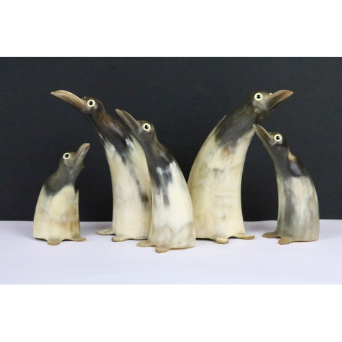 301 - Vintage silver plated cocktail stick holder together with a set of five carved horn penguins with gl... 