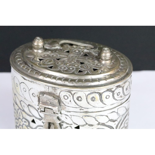 306 - Silverplated Chinese cricket box of oval form with moulded florals and pierced sides and lid with hi... 