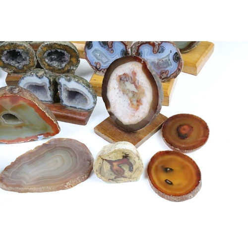 325 - Collection of geode mineral specimens, each sliced and mounted on wooden bases, including amethyst s... 