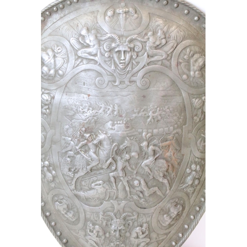 101 - Wall hanging composition shield decorated with a medieval battle scene and Gothic style decoration, ... 