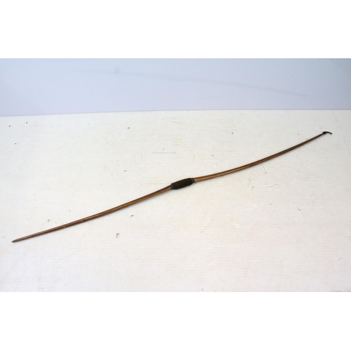 130 - Aldred of London yew wood longbow with horn nock to one end and grip, no string attached, stamped wi... 