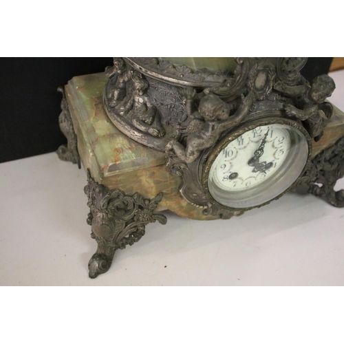 155 - Large late 19th century French onyx & spelter mantel clock surmounted by two putti, with plaque insc... 