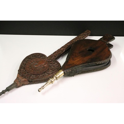 653 - Eastern hardwood heart-shaped carved wooden bellows, carved with central peacock and leaves verso 73... 