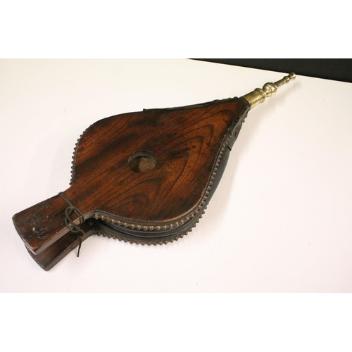 653 - Eastern hardwood heart-shaped carved wooden bellows, carved with central peacock and leaves verso 73... 