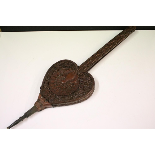 653 - Eastern hardwood heart-shaped carved wooden bellows, carved with central peacock and leaves verso 73... 