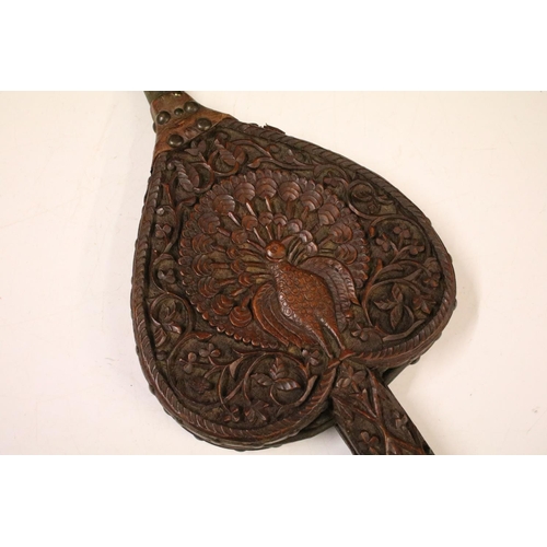 653 - Eastern hardwood heart-shaped carved wooden bellows, carved with central peacock and leaves verso 73... 