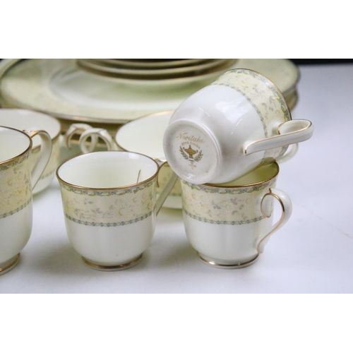 94 - Extensive Noritake tea and dinner service Chalfonte pattern tea service having yellow borders with f... 