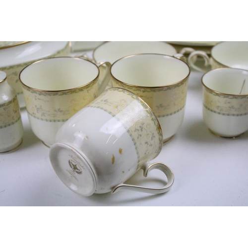 94 - Extensive Noritake tea and dinner service Chalfonte pattern tea service having yellow borders with f... 