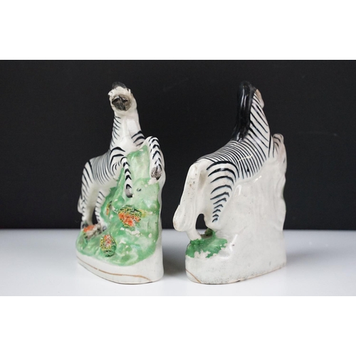 14 - Pair of 19th Century Staffordshire pottery zebras, approx 16.5cm tall