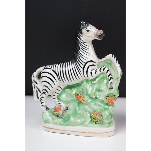 14 - Pair of 19th Century Staffordshire pottery zebras, approx 16.5cm tall