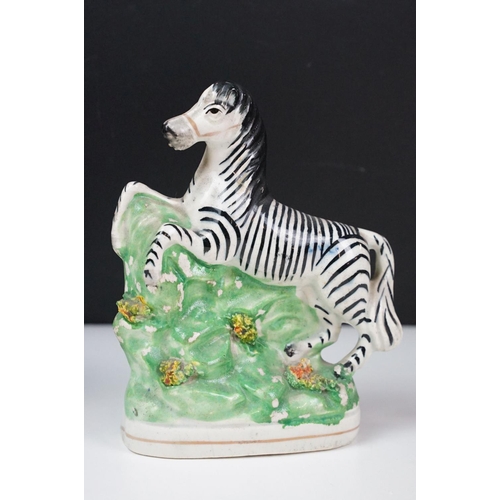 14 - Pair of 19th Century Staffordshire pottery zebras, approx 16.5cm tall