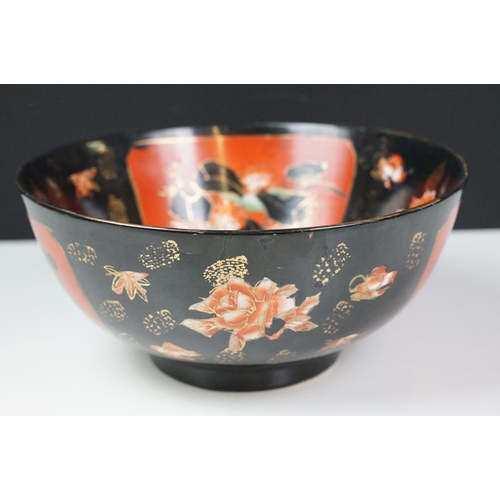 16 - Set of four Japanese black ground ceramic bowls decorated with red ground floral panels with gilt bo... 