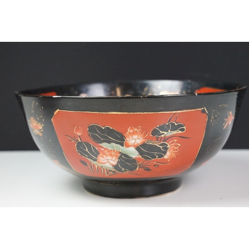 16 - Set of four Japanese black ground ceramic bowls decorated with red ground floral panels with gilt bo... 