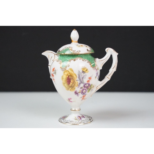 17 - Continental porcelain cabaret coffee set with hand painted floral decoration, comprising coffee pot,... 