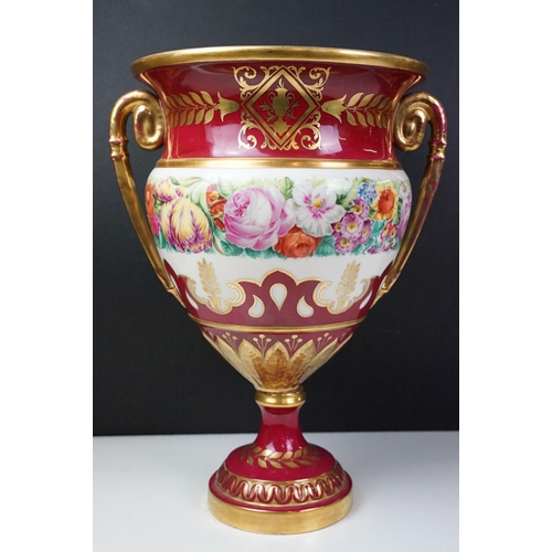 20 - 19th Century continental twin handled urn vase with floral decoration on a pink ground, with gilt de... 