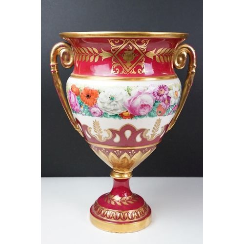 20 - 19th Century continental twin handled urn vase with floral decoration on a pink ground, with gilt de... 