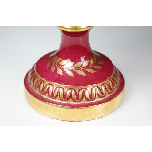 20 - 19th Century continental twin handled urn vase with floral decoration on a pink ground, with gilt de... 