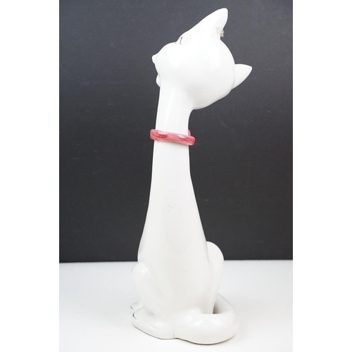 21 - Retro Italian pottery cat, white and black wearing a pink ribbon to neck, marked Italy to base, 45cm... 