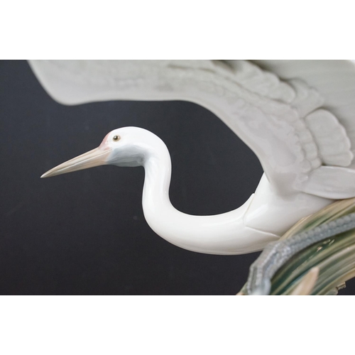 22 - Lladro Cranes porcelain figure group, no. 1456, one bird with outstretched wings on the water, anoth... 