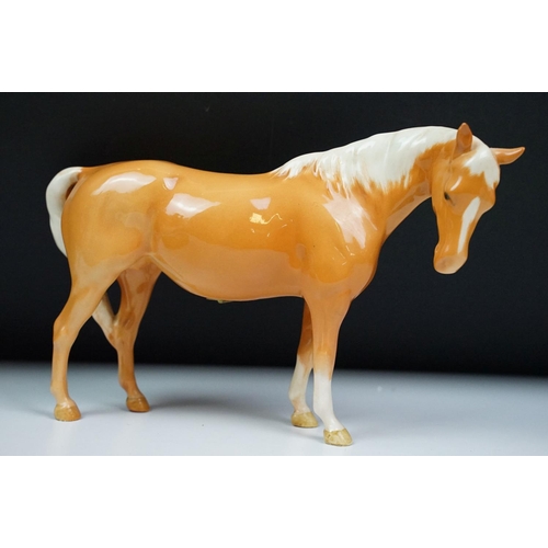 27 - Beswick - A porcelain figure of a Lipizzaner horse and rider, marked to base and numbered 53, approx... 