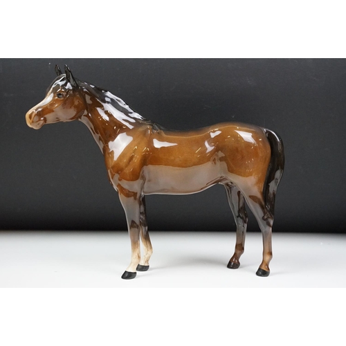 27 - Beswick - A porcelain figure of a Lipizzaner horse and rider, marked to base and numbered 53, approx... 