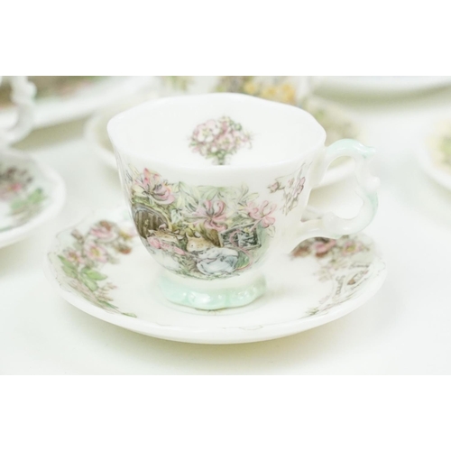 31 - Royal Doulton Brambly Hedge miniature tea ware to include teapot, 4 teacups & saucers, 3 tea plates,... 