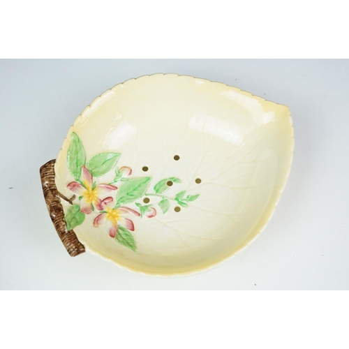 47 - Four Carlton Ware moulded leaf yellow ground dishes to include a footed example (approx 28cm long) a... 