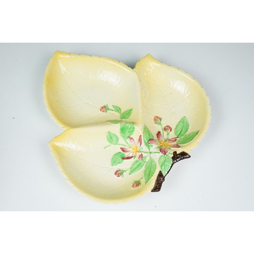 47 - Four Carlton Ware moulded leaf yellow ground dishes to include a footed example (approx 28cm long) a... 