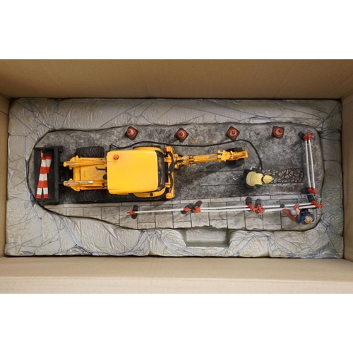 62 - Border Fine Arts limited edition figurine 'Essential Repairs' (no. 1519 of 1750) and a JCB Collectab... 