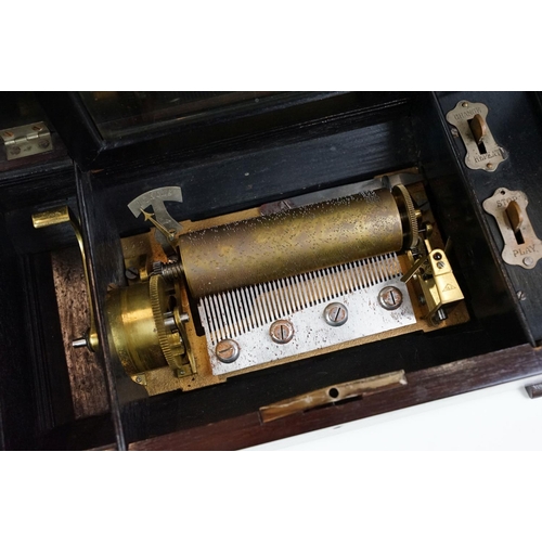 148 - 19th Century Swiss music box, the lid opening to a brass cylinder (approx 12cm long) and one piece c... 