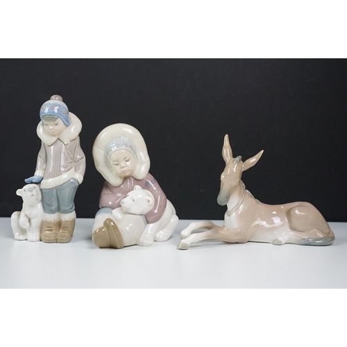 73 - Collection of Lladro ceramic figurines to include polar bears, birds, Inuit figures, nuns and other ... 