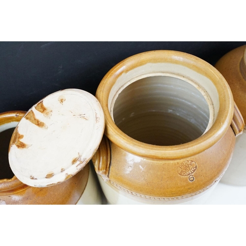 77 - Three Victorian stoneware jars to include one twin handled example. Measures 28cm.