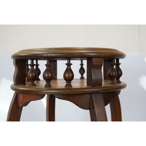 640 - Two tier circular plant stand, the top pierced with baluster supports on splayed legs, 97.5cm high x... 