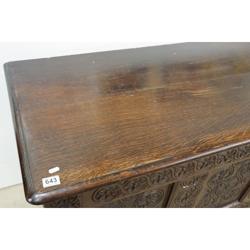 643 - Oak panelled chest, carved with stylised floral repeating designs, 79.5cm high x 142cm wide x 62cm d... 