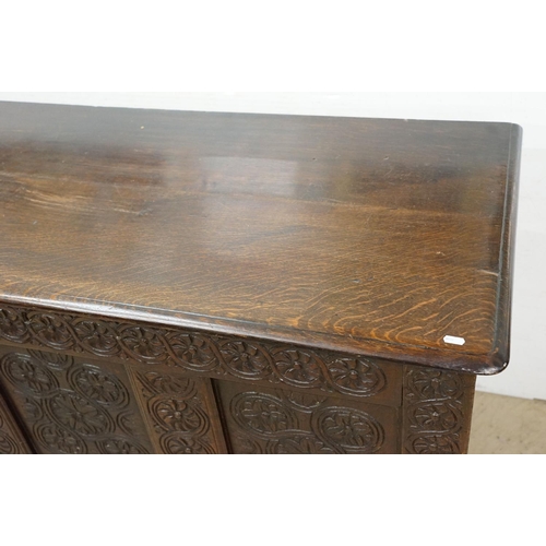 643 - Oak panelled chest, carved with stylised floral repeating designs, 79.5cm high x 142cm wide x 62cm d... 