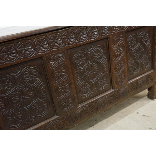 643 - Oak panelled chest, carved with stylised floral repeating designs, 79.5cm high x 142cm wide x 62cm d... 