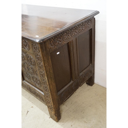 643 - Oak panelled chest, carved with stylised floral repeating designs, 79.5cm high x 142cm wide x 62cm d... 