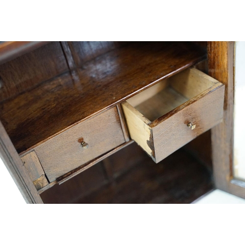 646 - Early 20th century oak glazed wall hanging cabinet, with shelf and two drawers, 44cm high x 36cm wid... 