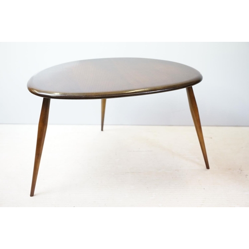 648 - Ercol nest of three dark elm pebble tables (lacking maker's labels), largest table 41cm high x 65cm ... 