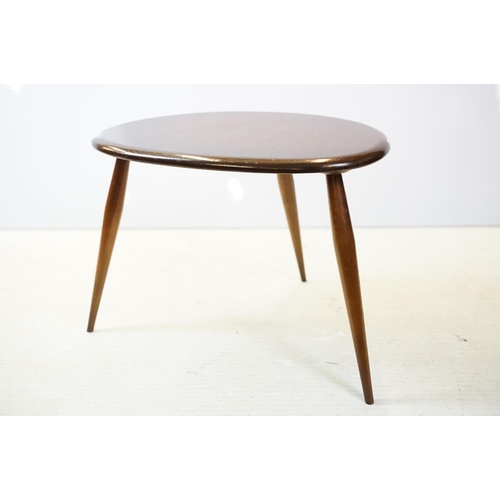 648 - Ercol nest of three dark elm pebble tables (lacking maker's labels), largest table 41cm high x 65cm ... 