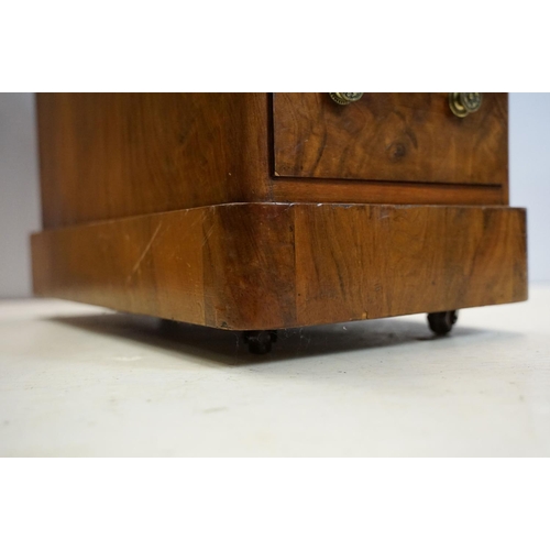 649 - Late 19th century walnut lady's kneehole desk, with cream leather inset top above an arrangement of ... 