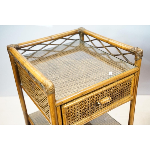 654 - Rattan chest with galleried, glazed top above three drawers, 80cm high x 82cm wide x 47cm deep toget... 