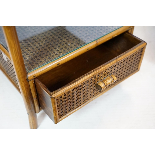 654 - Rattan chest with galleried, glazed top above three drawers, 80cm high x 82cm wide x 47cm deep toget... 